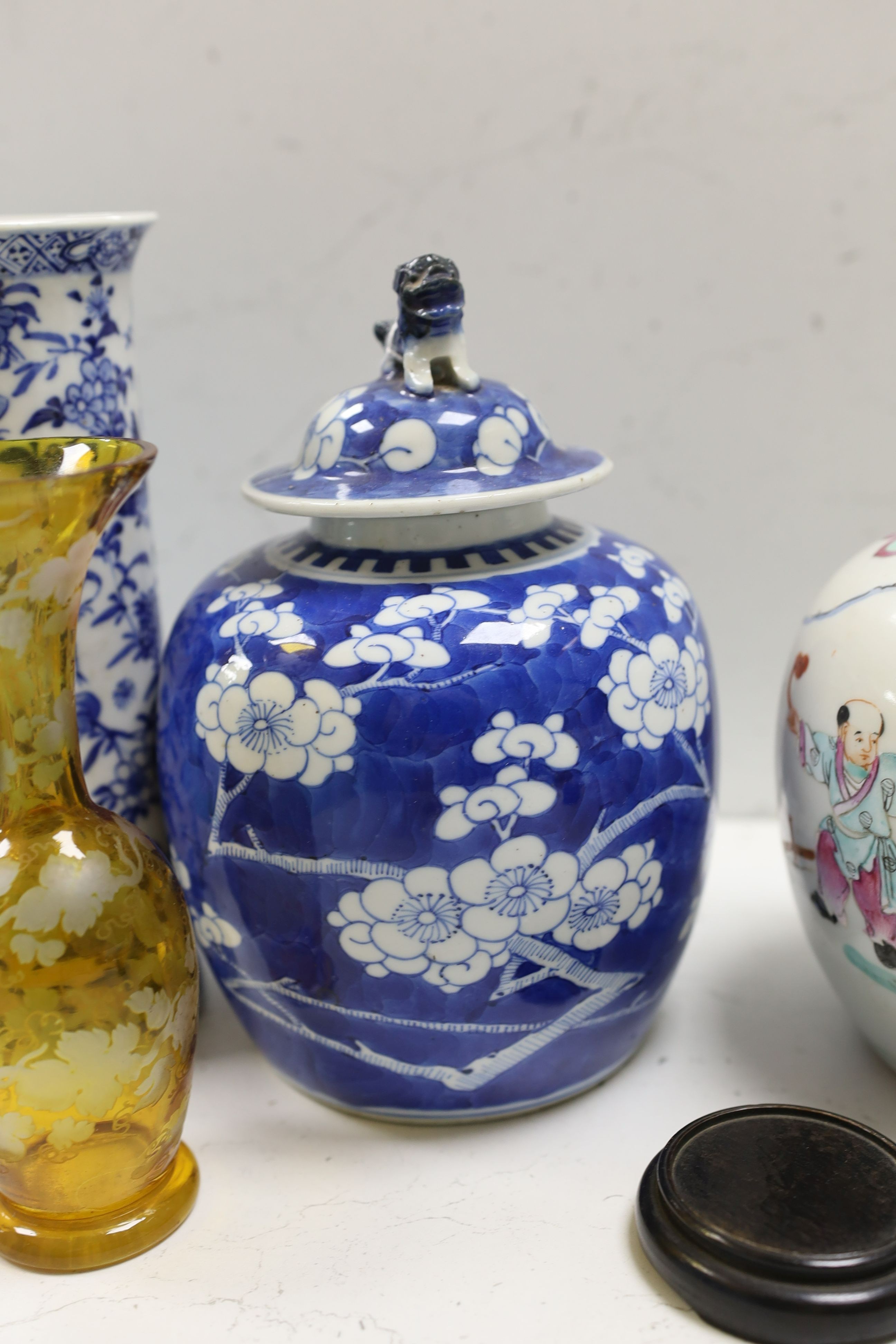 A Chinese famille rose ginger jar, a 19th century Chinese blue and white porcelain jar and cover, a blue and white cylinder vase, a small Chinese dish and orange glass vase (5)